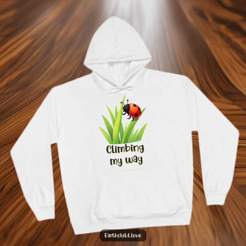Funny Kawaii Ladybug Hoodie featuring a delightful ladybug climbing grass, a warm and cozy funny gift idea for insect enthusiasts.